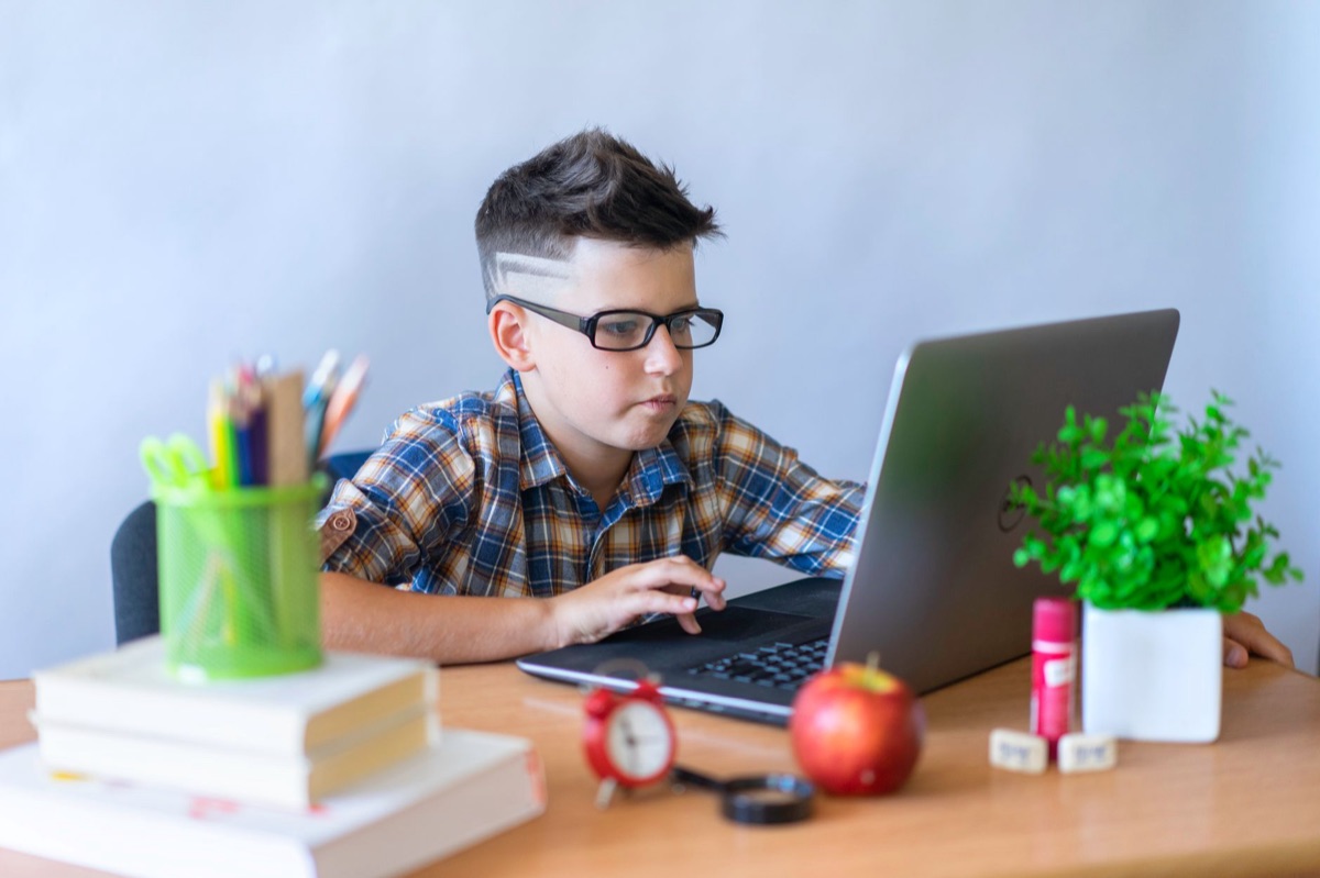 student using laptop for homework