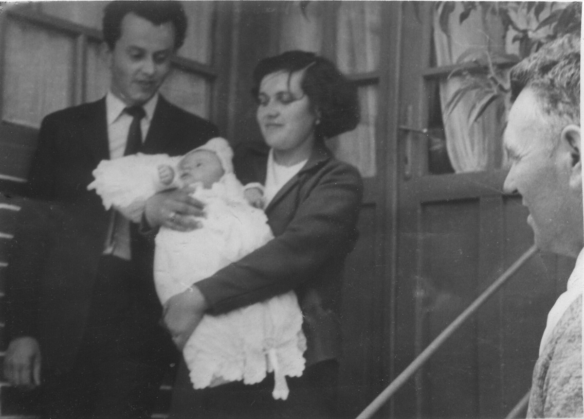baby with parent holding